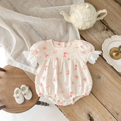 Pink Floral Puff Sleeve Romper with Eyelet Lace Cuffs – Baby Girl Summer Bubble Suit